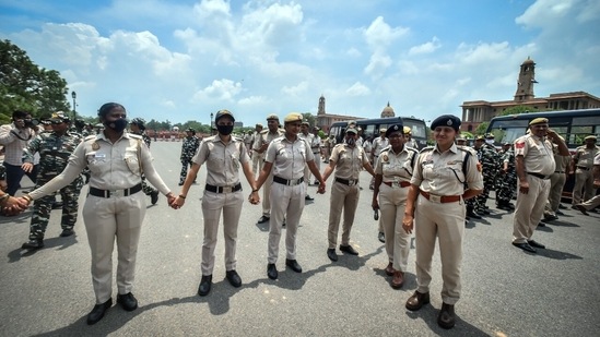 Delhi Police personnel on alert during Congress MPs' protest over the alleged misuse of investigative agencies and suspension of opposition legislators at Vijay Chowk near Parliament House in New Delhi.