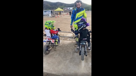 The image, taken from the viral Instagram video, shows the kids trying to give each other a pre-race fist bump. (Instagram/@mohawkwarrior135_)
