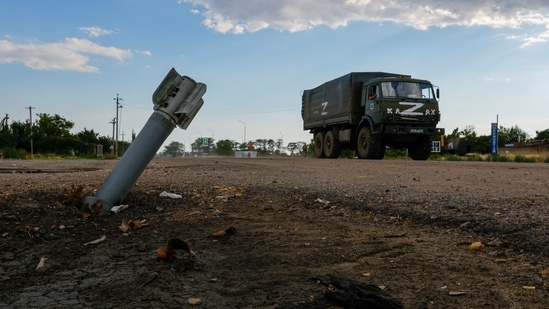 A Russian military truck drives past an unexploded munition during Ukraine-Russia conflict in the Russia-controlled village of Chornobaivka, Ukraine July 26, 2022. REUTERS/Alexander Ermochenko(REUTERS)