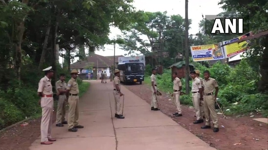 Caption: "Police deployed in Puttur after BJP youth wing worker Praveen Nettaru's murder in Bellare. (ANI Image)" Caption: "Police deployed in Puttur after BJP youth wing worker Praveen Nettaru's murder in Bellare. (ANI Image)"