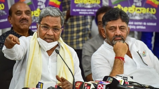 Leader of opposition and former CM Siddaramaiah with KPCC President DK Shivakumar. (PTI Image)