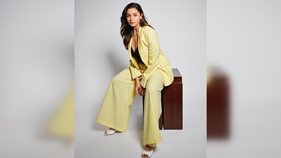 Alia Bhatt teamed her boss lady look with a black bodysuit featuring a plunging neckline and a pair of white square-toe pyramid heels.(Instagram/@aliaabhatt)