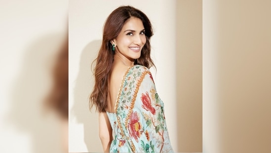Vaani Kapoor's outfit comes with a matching dupatta which she hung on her right shoulder. She teamed her look with small green earrings and left her hair open.(Instagram/@_vaanikapoor_)