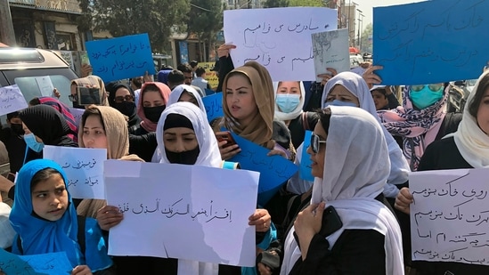FILE - Afghan women chant and hold signs of protest during a demonstration in Kabul, Afghanistan.(AP)