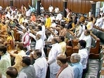BJP members protest in the Lok Sabha during ongoing Monsoon Session of Parliament in New Delhi on Thursday.