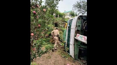 A policeman at the accident site after a Himachal Road Transport Corporation (HRTC) bus skidded off the road when it was on its way to Theog from Jarai in Shimla district on Thursday. (HT Photo)