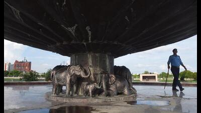 A security guard near the site at Ambedkar memorial after one of the elephant statues went missing from its place in Lucknow, on Thursday. (Deepak Gupta/HT Photo)