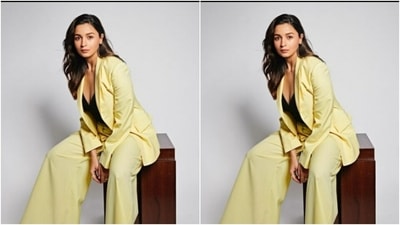 Alia wore a black cropped top with a plunging neckline, and layered it with lemon-yellow blazer and a pair of lemon-yellow formal trousers. (Instagram/@aliaabhatt)