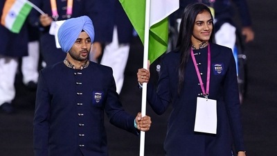 India's flag bearers Manpreet Singh and PV Sindhu take part in the opening ceremony for the Commonwealth Games at the Alexander Stadium in Birmingham (AFP) India's flag bearers Manpreet Singh and PV Sindhu take part in the opening ceremony for the Commonwealth Games at the Alexander Stadium in Birmingham (AFP)
