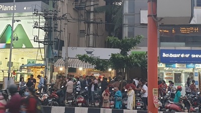 Customers of a tea shop encroaching footpath in Kammanahalli. (Twitter) Customers of a tea shop encroaching footpath in Kammanahalli. (Twitter)