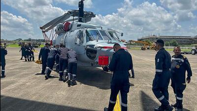 Indian Navy personnel receive delivery of two MH-60 R multirole helicopters from the US, at Cochin International Airport in Kochi on Thursday. The third helicopter is scheduled to be delivered in August. (PTI) Indian Navy personnel receive delivery of two MH-60 R multirole helicopters from the US, at Cochin International Airport in Kochi on Thursday. The third helicopter is scheduled to be delivered in August. (PTI)