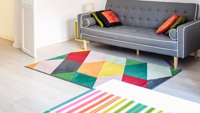 2. Create Zones With Rugs - If you have a large living room with a lot of empty space, creating different vibes with the help of rugs could be a good idea. Ideal for large spaces, use different rugs and create zones in a room without the help of any partition. For instance, rather than walls you can place a rug for each space. (Ksenia Chernaya) 2. Create Zones With Rugs - If you have a large living room with a lot of empty space, creating different vibes with the help of rugs could be a good idea. Ideal for large spaces, use different rugs and create zones in a room without the help of any partition. For instance, rather than walls you can place a rug for each space. (Ksenia Chernaya)