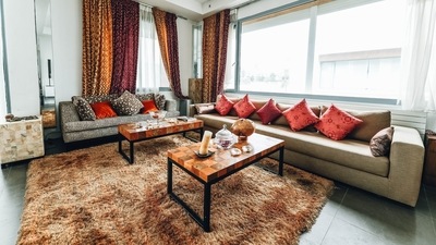 1. Layer Up Your Rugs - Rugs are not only functional but can also prove to be a decorative piece. Layering rugs can solve the woe of decoration. One can start with placing the bigger rug at the bottom and place smaller rugs on top of it. Colour blocking in contrast to the theme of the living room will help increase the aesthetic quotient of the living room. (Naim Benjelloun) 1. Layer Up Your Rugs - Rugs are not only functional but can also prove to be a decorative piece. Layering rugs can solve the woe of decoration. One can start with placing the bigger rug at the bottom and place smaller rugs on top of it. Colour blocking in contrast to the theme of the living room will help increase the aesthetic quotient of the living room. (Naim Benjelloun)