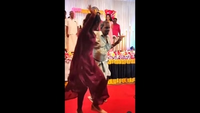 The image, taken from the video posted on Instagram, shows grandpa grooving with granddaughter to the tunes of Devadoothar Paadi from the film Nna Thaan Case Kodu at a wedding. (Instagram/@binu_kokkadan)