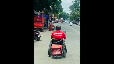 The image, taken from the viral video posted on Instagram, shows a specially-abled Zomato delivery agent. (Instagram/@groming_bulls)