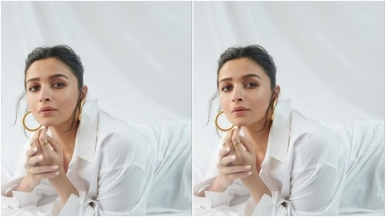 Alia teamed a white shirt with folded sleeves with a pair of distressed denim trousers with wide legs and tassel details all throughout.(Instagram/@aliaabhatt)
