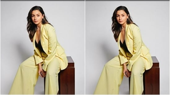 Alia wore a black cropped top with a plunging neckline, and layered it with lemon-yellow blazer and a pair of lemon-yellow formal trousers.(Instagram/@aliaabhatt)