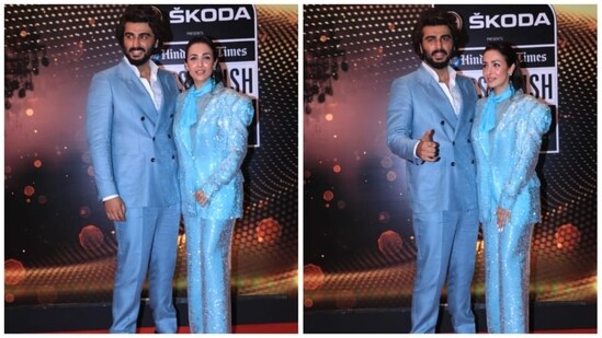 For the occasion, Arjun Kapoor and Malaika Arora twinned in fancy blue outfits. While the former looked dapper in a blue pantsuit, the latter stunned in a dazzling blue pantsuit.(HT Photo/Varinder Chawla)