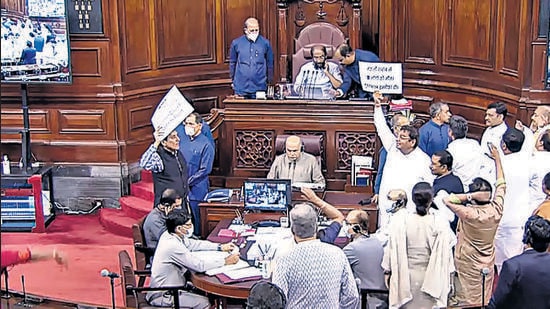 Opposition MPs holding placards stage a protest in the well of Rajya Sabha during the Monsoon Session of Parliament, in New Delhi on Thursday. (ANI)