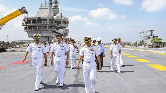 Indian Navy personnel after taking delivery of the prestigious indigenous aircraft carrier Vikrant' from builder Cochin Shipyard Ltd in Kochi on Thursday. (PTI Photo)