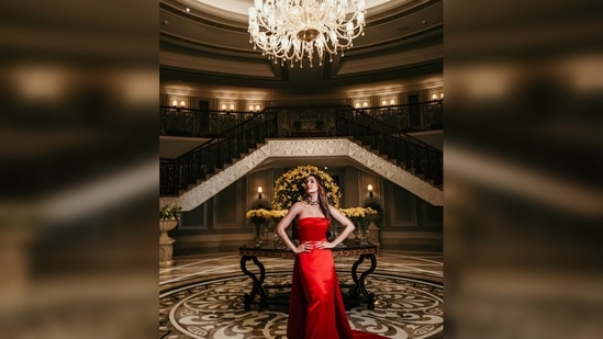 Malaika Arora lived her royal dream as she slipped into this gorgeous red satin strapless dress featuring a floor-sweeping trail. Her outfit is from the clothing line of House of Eda.(Instagram/@malaikaaroraofficial)