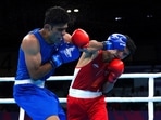 India's Shiva Thapa, right, and Pakistan's Suleman Baloch during the Men's Over 60kg-63.5kg (Light Welter) - Round of 32 at The NEC on day one of 2022 Commonwealth Games in Birmingham, England