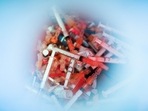 Syringes used for the monkeypox vaccine are seen inside of a bucket in a drive-through monkeypox vaccination point at the Westchester Medical Center in Valhalla, New York.