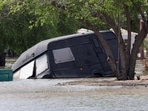 A flooded street is pictured in the UAE's Fujairah emirate following heavy rainfall . A flooded street is pictured in the UAE's Fujairah emirate following heavy rainfall .