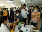 A person being inoculated with a booster dose of Covid-19 vaccine at district hospital Sector 30 , in Noida. A person being inoculated with a booster dose of Covid-19 vaccine at district hospital Sector 30 , in Noida.