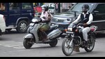 A woman riding a two-wheeler in Prayagraj. (HT photo) A woman riding a two-wheeler in Prayagraj. (HT photo)