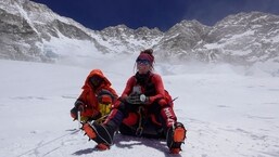 Norwegian mountainer Kristin Harila posing on route to summit Mount Everest (height 8848 meters).