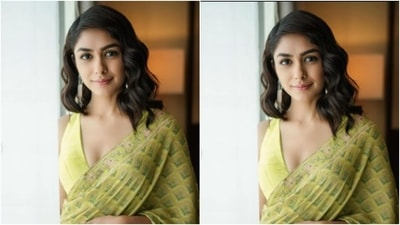 Mrunal teamed the saree with a lemon-yellow sleeveless blouse that featured a plunging neckline. (Instagram/@mrunalthakur)