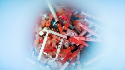 Syringes used for the monkeypox vaccine are seen inside of a bucket in a drive-through monkeypox vaccination point at the Westchester Medical Center in Valhalla, New York. (REUTERS)