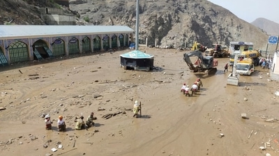 Rescuers work following the flood in Imamzadeh Davoud village in the north of Tehran, Iran. (REUTERS)