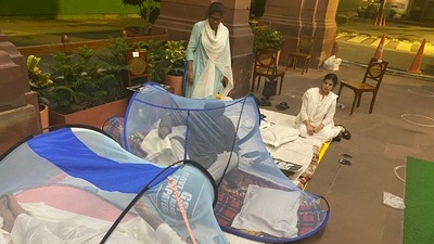 Protesting MPs got hold of mosquito nets on Thursday night during their 50-hour non-stop protest inside the Parliament complex. Protesting MPs got hold of mosquito nets on Thursday night during their 50-hour non-stop protest inside the Parliament complex. 