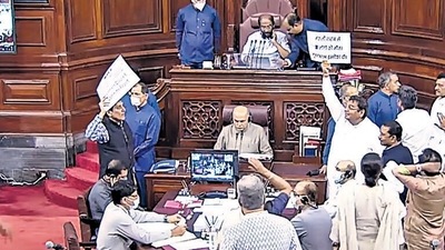 Opposition MPs holding placards stage a protest in the well of Rajya Sabha during the Monsoon Session of Parliament, in New Delhi on Thursday. (ANI) (HT_PRINT)