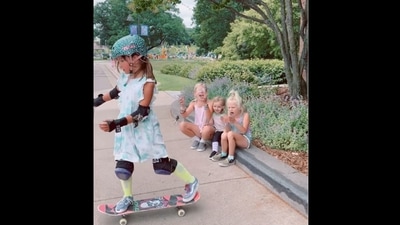 The image, taken from a viral clip on Instagram, shows a girl doing a skateboard trick as her sisters look on. (Instagram/@thejohnsonettes)