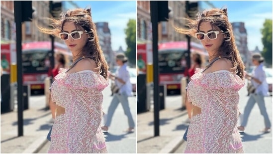 Aamna decked up in a white cropped top intricately decorated ted in pink floral patterns and pink zari. The top also featured quarter sleeves in perforated fabric. Aamna paired her top with a short white skirt featuring the same designs and layering it with pink zari details.(Instagram/@aamnasharifofficial)