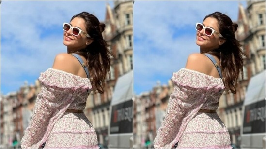 Aamna wore her tresses open with a part into a messy top bun and looked super stylish in drawn eyebrows, contoured cheeks and a shade of pastel pink lipstick.(Instagram/@aamnasharifofficial)