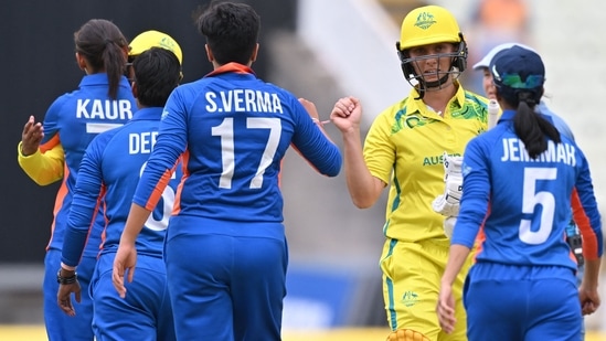 IND-W vs AUS-W: Australia's Ash Gardner (2R) celebrates after beating India.(AFP) IND-W vs AUS-W: Australia's Ash Gardner (2R) celebrates after beating India.