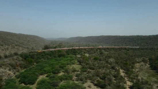 The image, taken from the Twitter video, shows the panoramic view of train crossing lush landscape of Dara Ghats. (Twitter/@RailMinIndia)