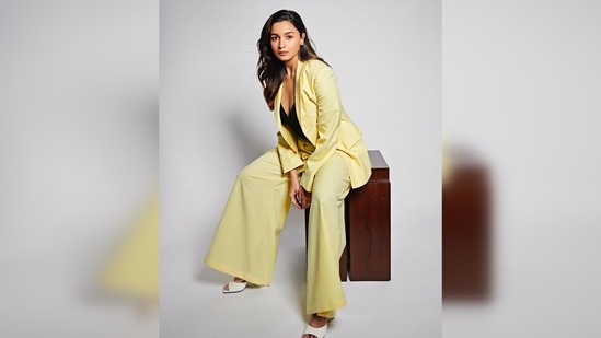 Alia Bhatt teamed her boss lady look with a black bodysuit featuring a plunging neckline and a pair of white square-toe pyramid heels.(Instagram/@aliaabhatt)