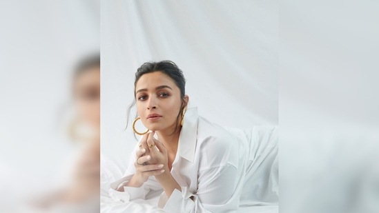 Alia Bhatt left her top shirt buttons unbuttoned for the street-style look. Her high-rise denim featured rip detailing all over.(Instagram/@aliaabhatt)