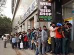 People stand in a queue outside a liquor store in New Delhi. (ANI file photo) People stand in a queue outside a liquor store in New Delhi. (ANI file photo)