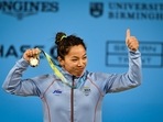 India's Mirabai Chanu with the gold medal after winning women's 49kg weightlifting category match of the Commonwealth Games 2022&nbsp;