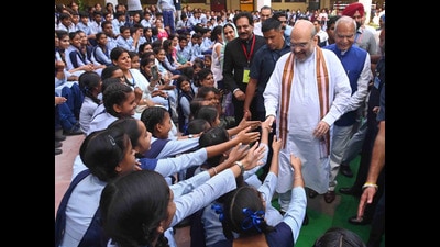 Union home minister Amit Shah greeting schoolchildren at the inauguration of Government Model High School, Mauli Jagran, in Chandigarh on Saturday. (Ravi Kumar/HT) Union home minister Amit Shah greeting schoolchildren at the inauguration of Government Model High School, Mauli Jagran, in Chandigarh on Saturday. (Ravi Kumar/HT)