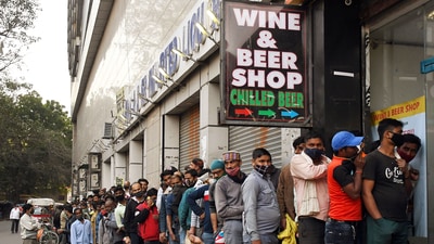 People stand in a queue outside a liquor store in New Delhi. (ANI file photo) People stand in a queue outside a liquor store in New Delhi. (ANI file photo)