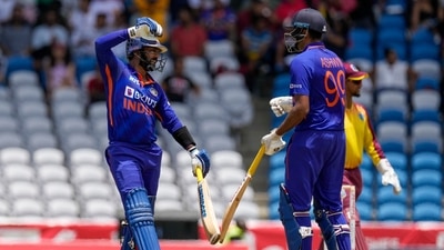 India's Dinesh Karthik, left, celebrates with Ravichandran Ashwin during their partnership against Wes Indies in the first T20 cricket match at Brian Lara Cricket Academy in Tarouba, Trinidad and Tobago (AP)