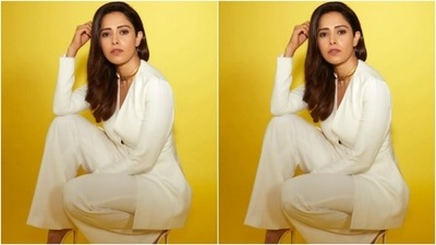 Nushrratt decked up in a white blazer with a plunging neckline and full sleeves. The white blazer featured buttons in the middle and hugged Nushrratt’s shape perfectly. (Instagram/@nushrrattbharuccha)