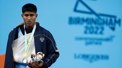 Commonwealth Games 2022: Silver medallist India's Sanket Mahadev Sargar celebrates on the podium (REUTERS)